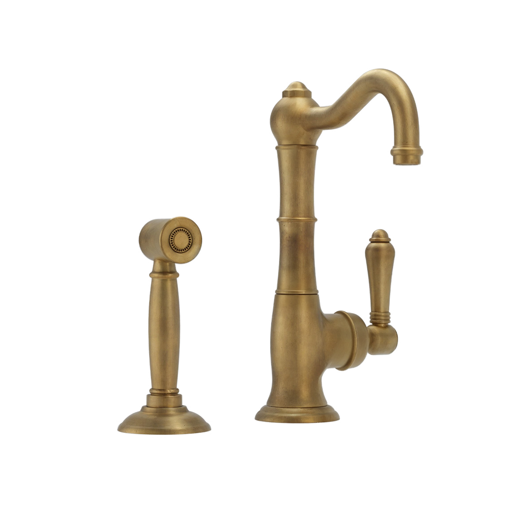 Raw Brass kitchen faucet with spray head on a white background